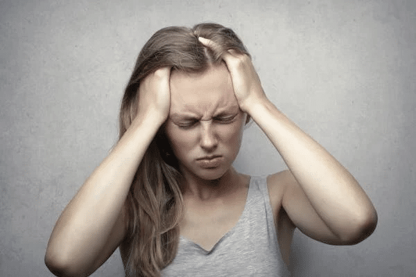 woman experiencing a headache