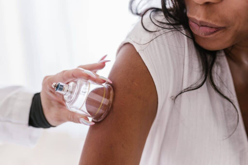 woman receives cupping therapy on her arm from professional therapist