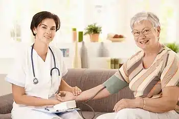 doctor checking patient blood pressure